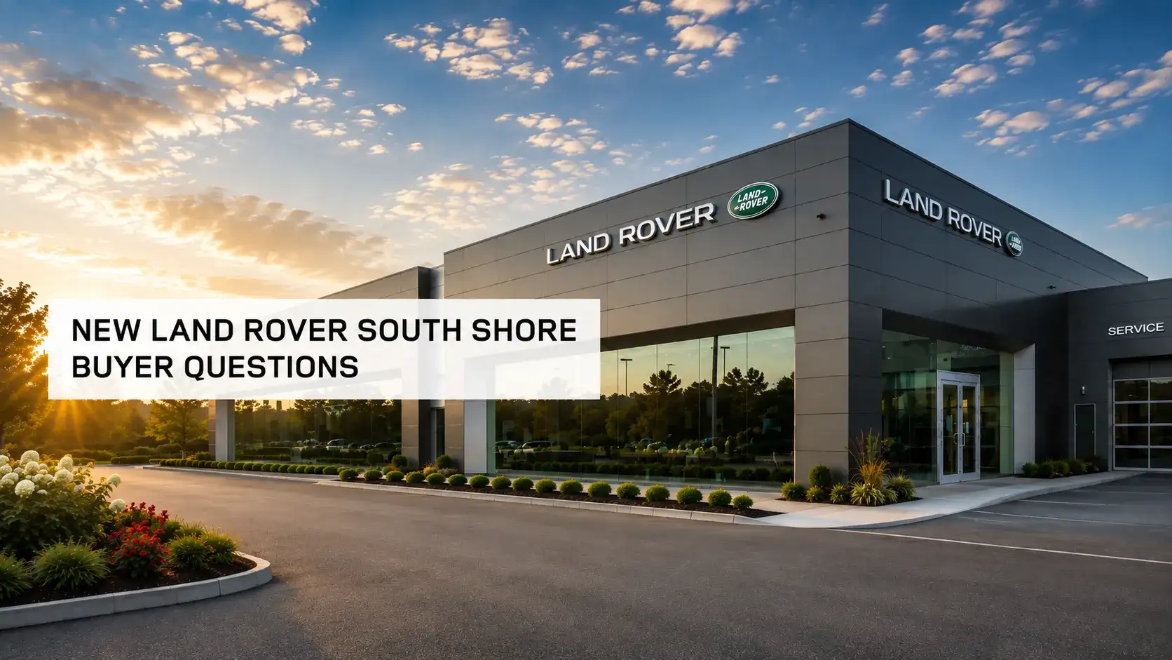 Land Rover South Shore showroom exterior, with a product specialist talking to two customers in the parking lot