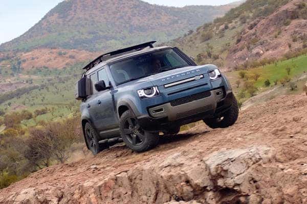 land rover defender on off-road mountainous terrain