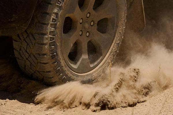 tire on dusty dirt road
