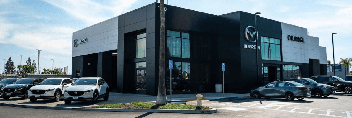 Mazda of Orange dealership exterior and parking lot.