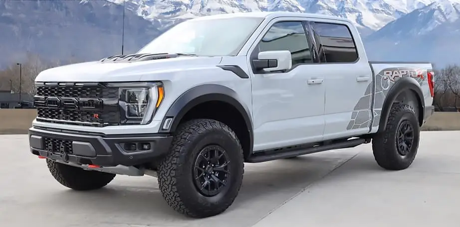 Gray Ford F-150 RaptorR in front of Utah Mountains