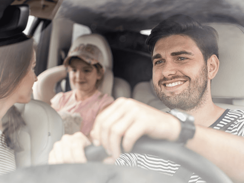 family driving in a mazda
