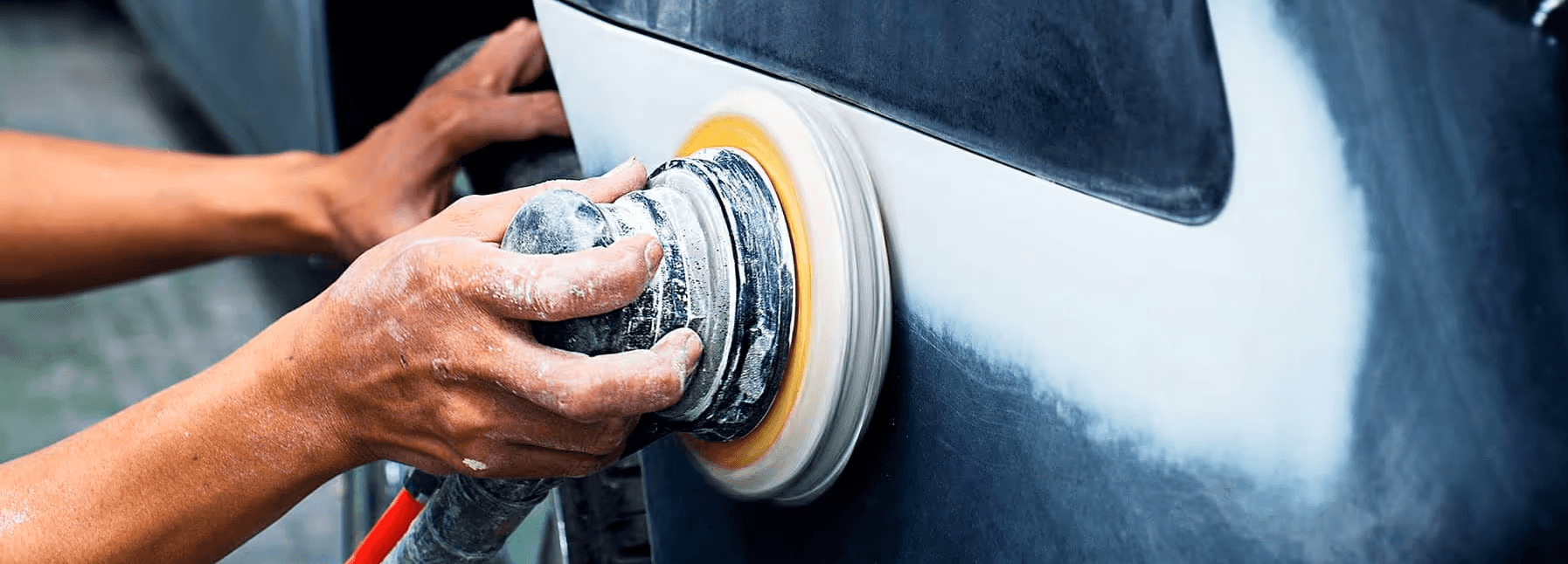 tech doing vehicle body work