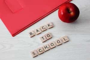 Scrabble pieces spelling out "back to school"