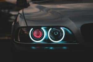 One side of headlights on a Mitsubishi car that are turned on