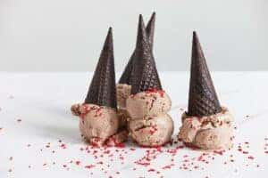 Four Ice Cream Cones upside down on a white table with a white background