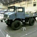 One of the first make and models of a Mitsubishi vehicle in a workshop