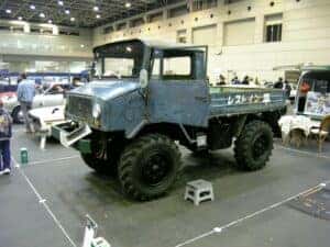 One of the first make and models of a Mitsubishi vehicle in a workshop