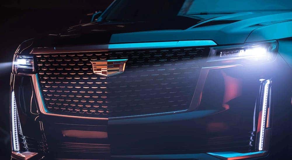 Close up of the grille on a black 2022 Cadillac Escalade at a Cadillac dealer near me