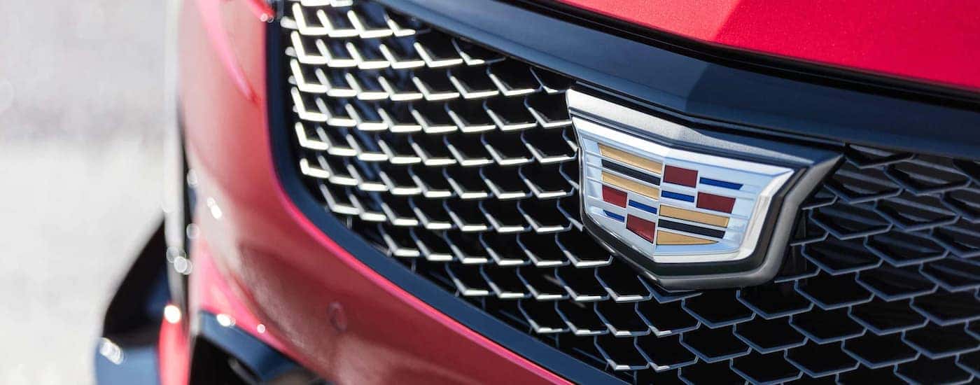 Close up of the grilled and badge on a red 2022 Cadillac CT4-V Blackwing