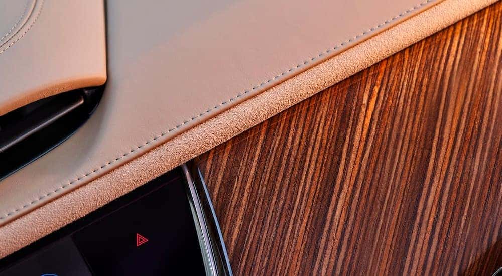 Close up of the the woodgrain and tan leather interior in a 2022 Cadillac XT6