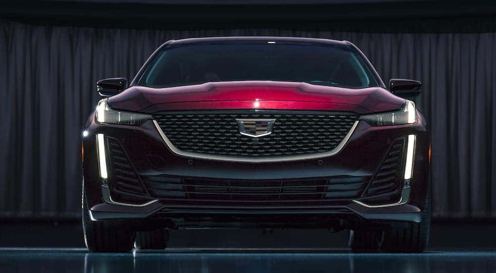 Front view of a red 2020 Cadillac CT5 in the showroom of a used Cadillac dealership