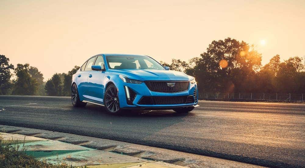 A blue 2023 Cadillac CT5-V Blackwing is shown from the front at an angle after leaving a Minot car dealer.