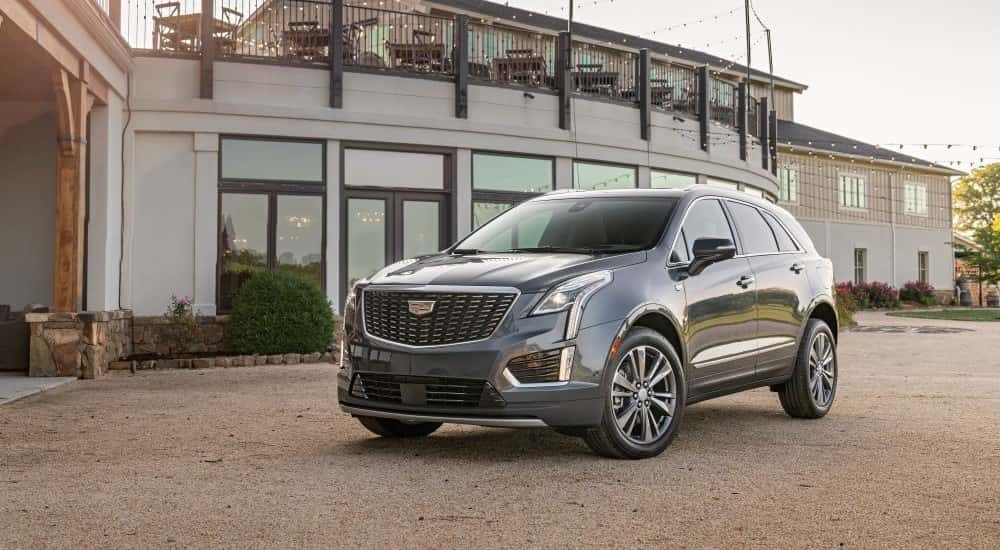 A grey 2020 Cadillac XT5 Premium is shown parked on a dirt lot.