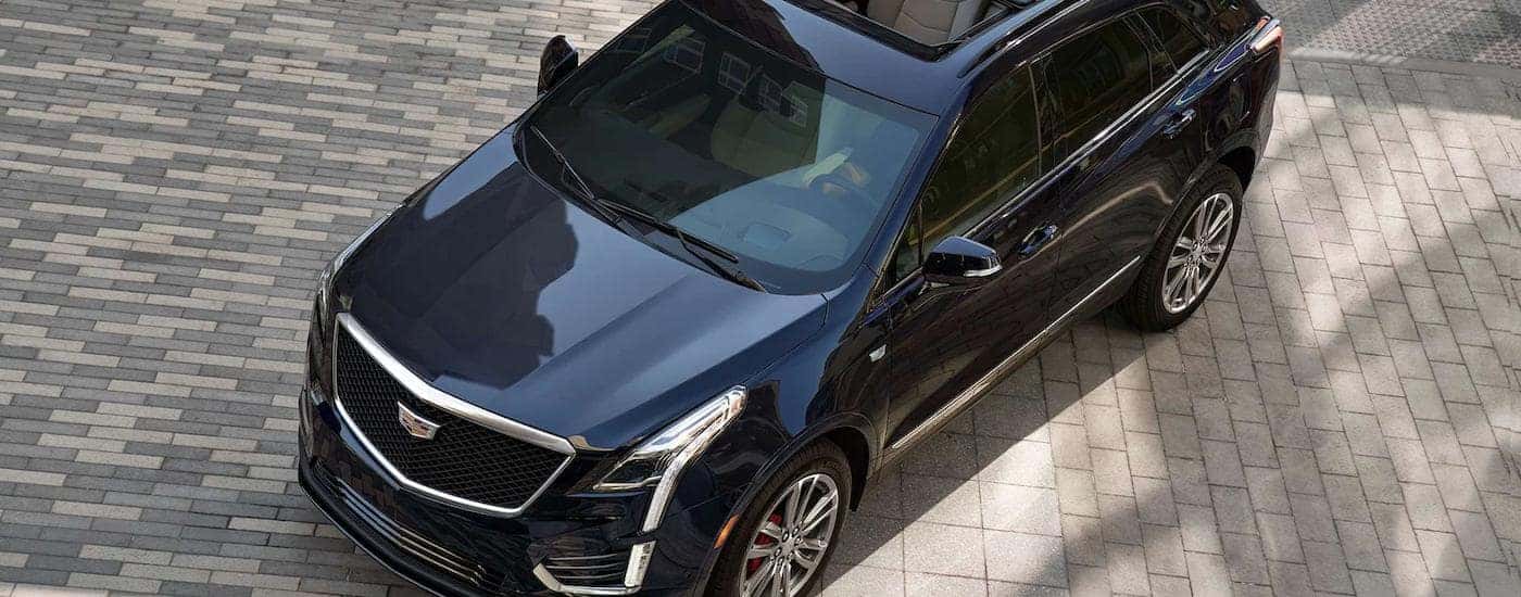 A blue 2022 Cadillac XT5 is shown from a high angle at a North Dakota Cadillac dealer.