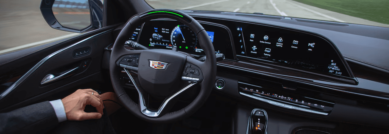 A driver using Super Cruise hands-free driving in the 2021 Cadillac Escalade