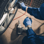 An engineer working on a vehicle's tires