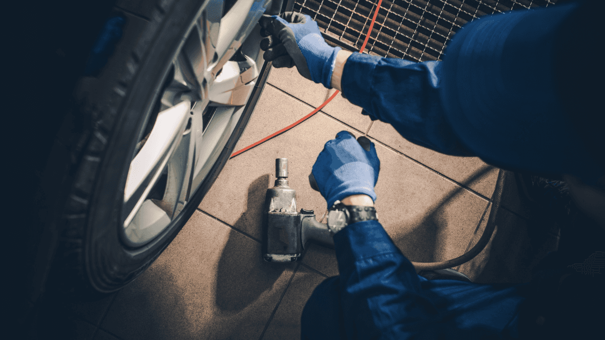 An engineer working on a vehicle's tires