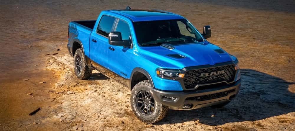 Side profile of A BLUE 2026 Ram 1500 