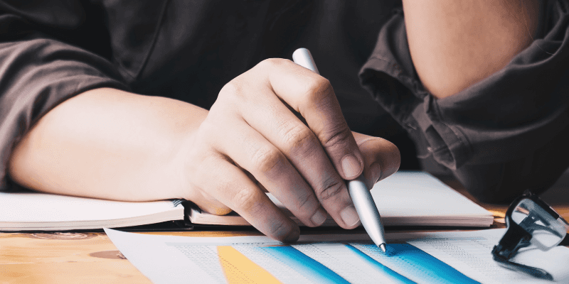 Reviewing Contract Terms with Pen in Hand