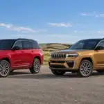 Red two-row Jeep Grand Cherokee parked beside a longer gold Grand Cherokee L