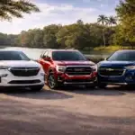 SUVs by the lakeside at sunset