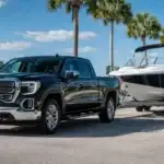Coastal drive with truck and boat