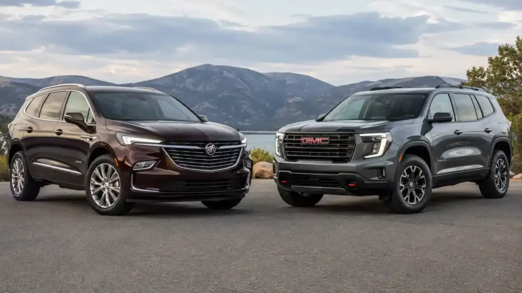 Burgundy and GMC SUVs by the Lake