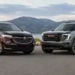 Burgundy and GMC SUVs by the Lake