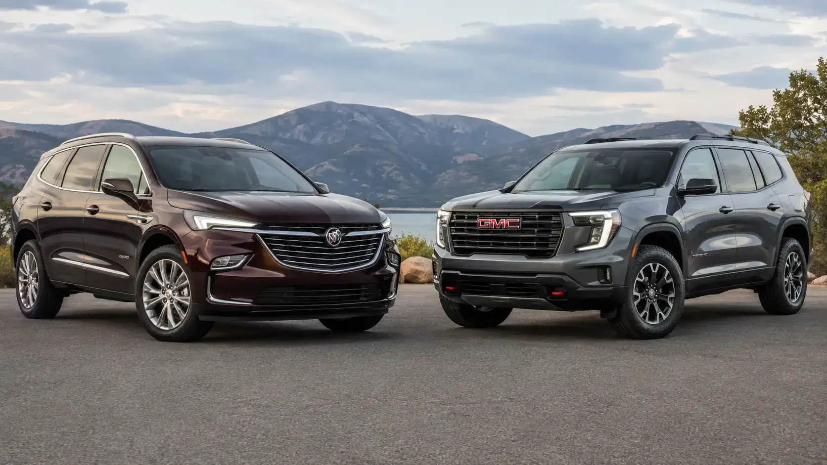 Burgundy and GMC SUVs by the Lake