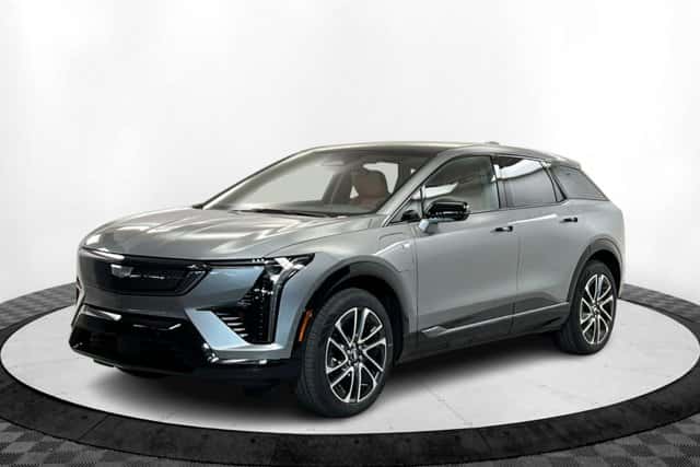 Gray 2027 Cadillac OPTIQ electric SUV displayed in a showroom, highlighting modern design and efficiency in St. George, UT.