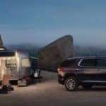 A 2022 Chevy Traverse has towed a trailer to a campsite.