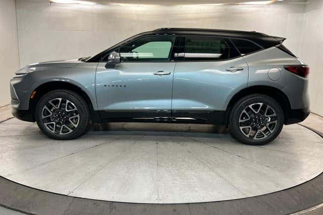 Side profile of a 2026 Chevy Blazer SUV displayed indoors on a rotating platform in St. George, UT