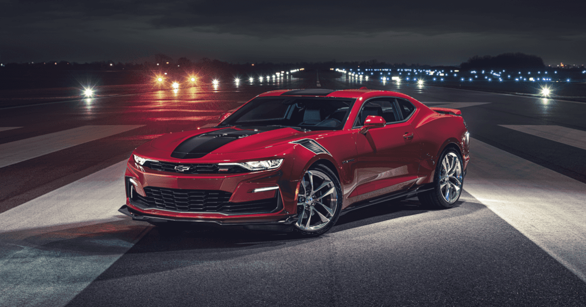 A 2024 Camaro in the middle of a runway in the night