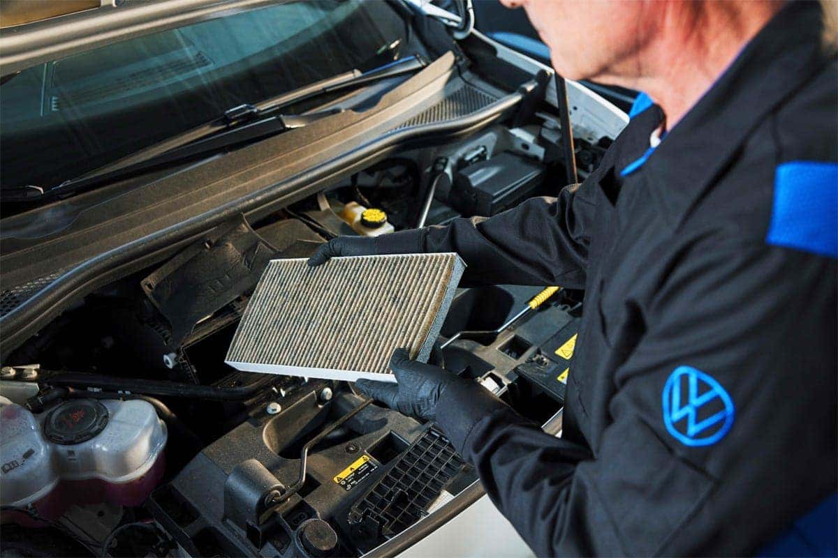 VW tech installing OEM filter