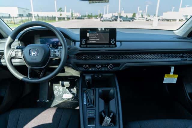 Interior of 2025/2026 Honda Accord showing dashboard infotainment and steering controls