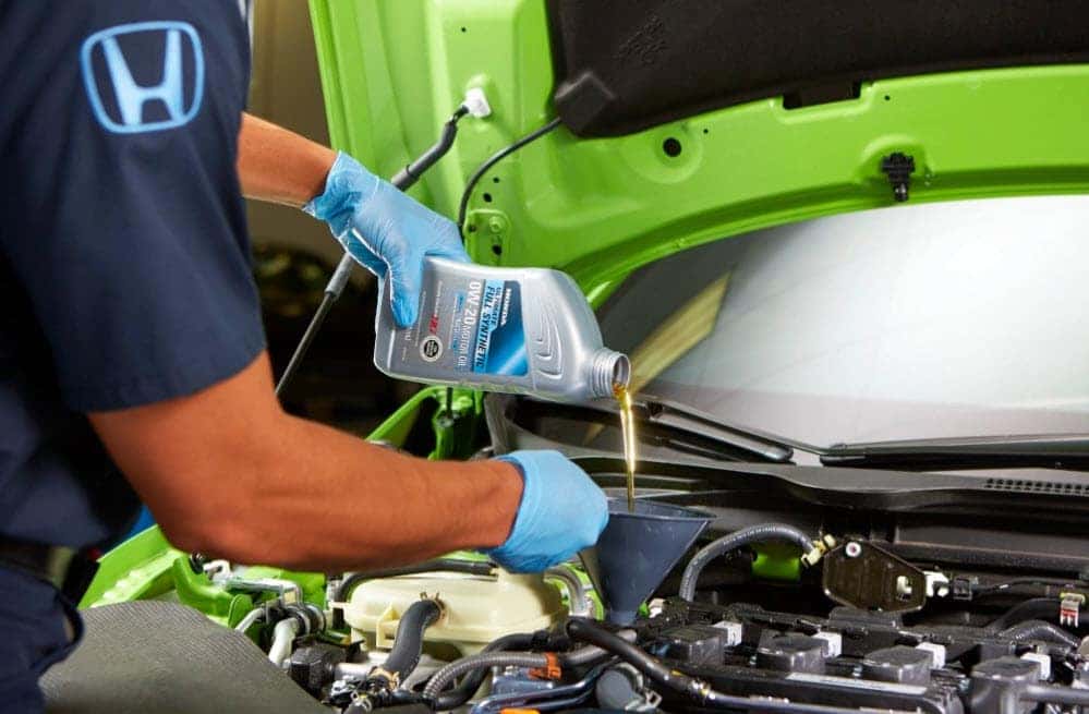 Honda certified technician performing oil change service at Zeigler Honda of Racine Wisconsin