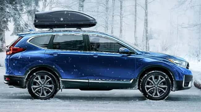 Honda CR-V equipped for winter driving with roof rack and snow tires near Racine Wisconsin