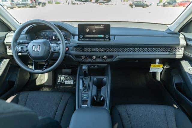 Interior features and dashboard of a used Honda Accord