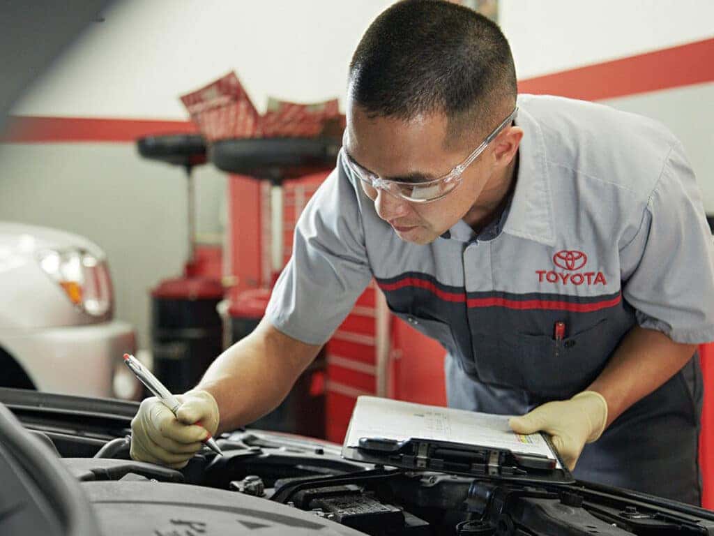 A service technician working on Toyota parts